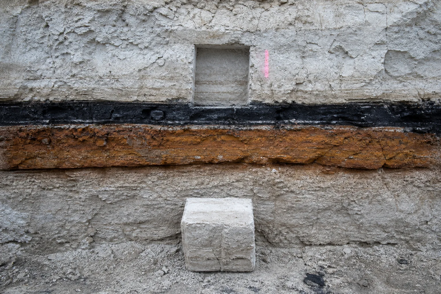 Trench-wall sample block beneath its matching extraction niche