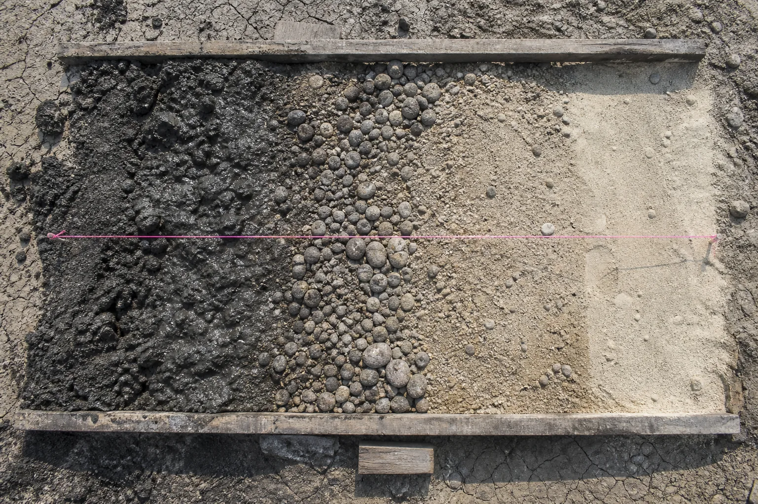 Glacial-material spoil run from wet till to sorted gravel and sand